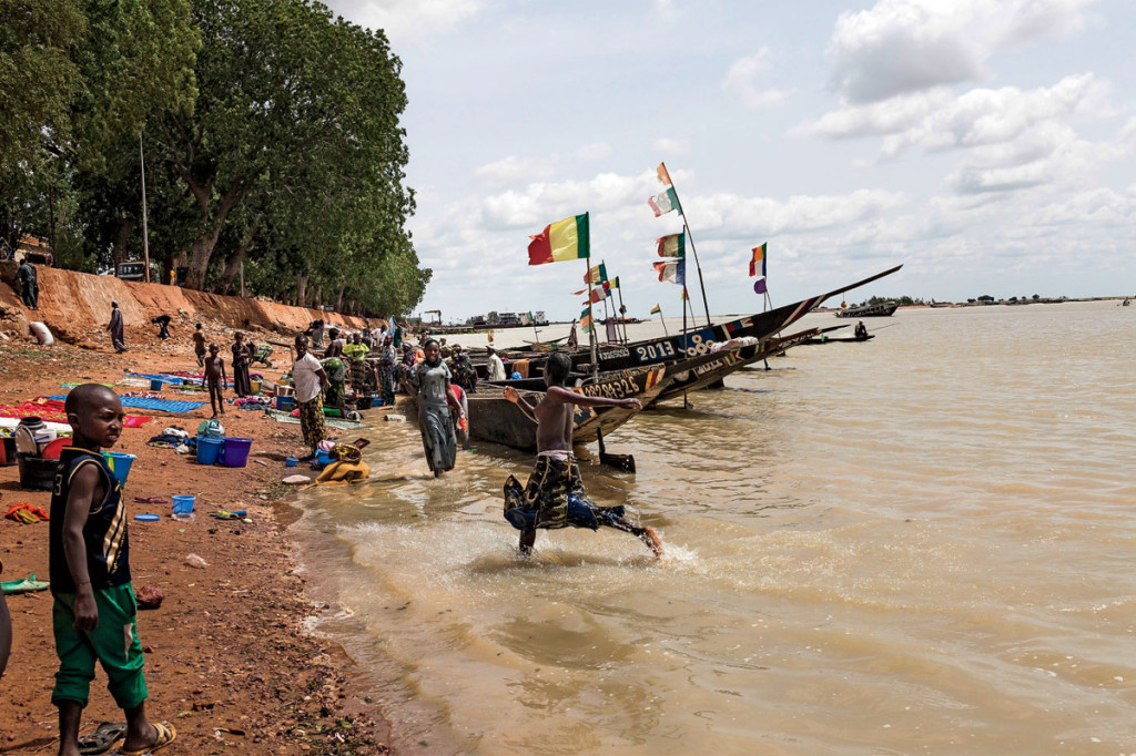 The Niger River: the books' conduit to safety and the author's route back into the conflict zone. Photo: Marco Di Lauro/Reportage by Getty Images