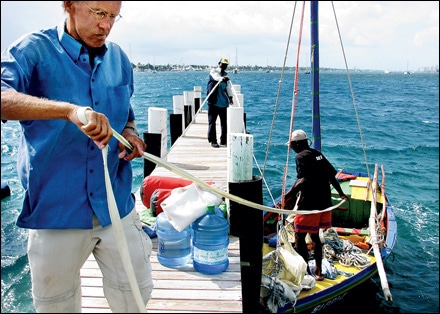 Geert van der Kolk and crew members Jean Oblit Laguerre and Gracien Alexandre tie up the Sipriz near Miami Photo: courtesy of Trenton Daniel