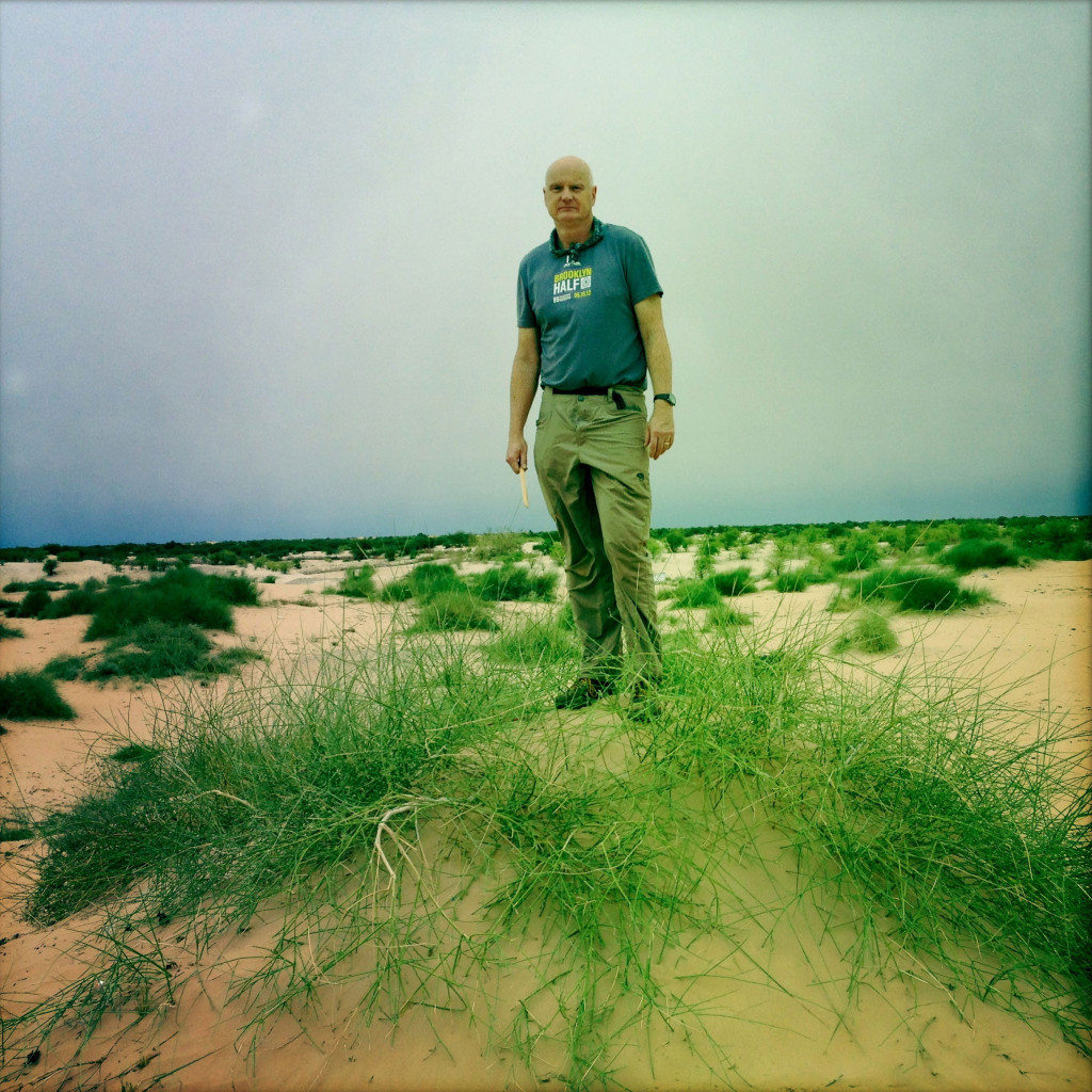 Patrick Symmes outside Timbuktu, Mali. Bonfire of the Humanities, Outside. Photographer Marco Di Lauro/Getty Reportage