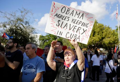 Protesters in the Little Havana neighborhood of Miami hold a demonstration in December 2014 against President Barack Obama’s plan to normalize relations with Cuba. (Photo: Lynne Sladky/AP)